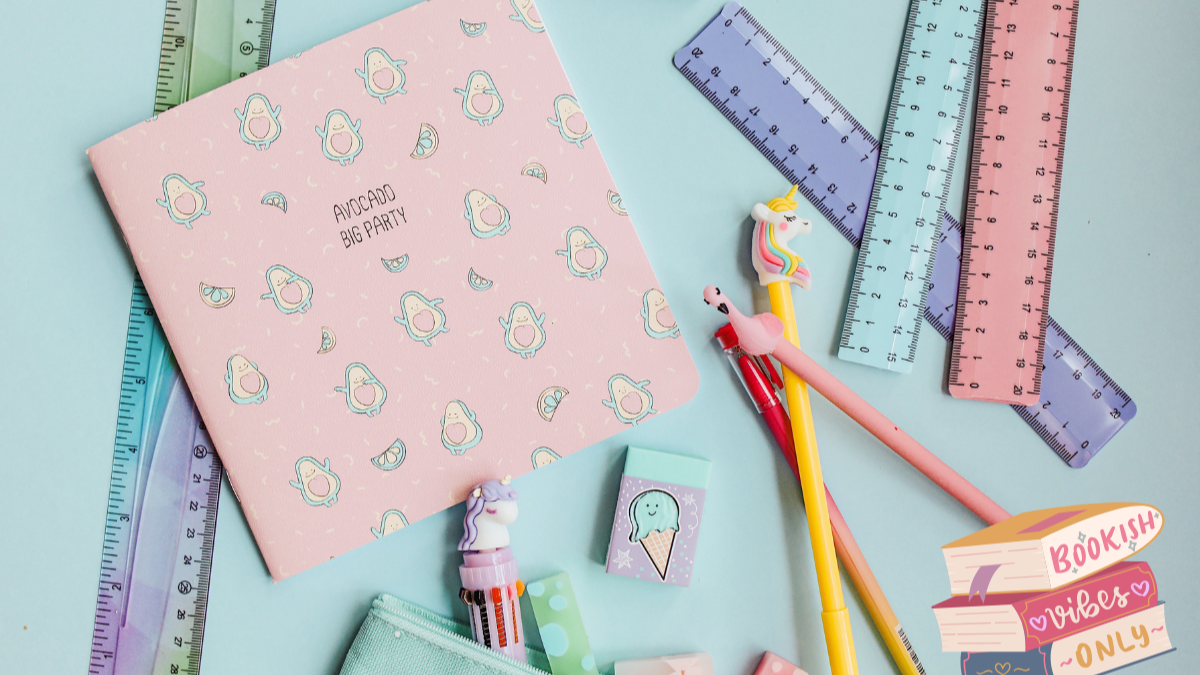 Stationery items including a pink notebook, rulers, pencils, and erasers on a light blue background.